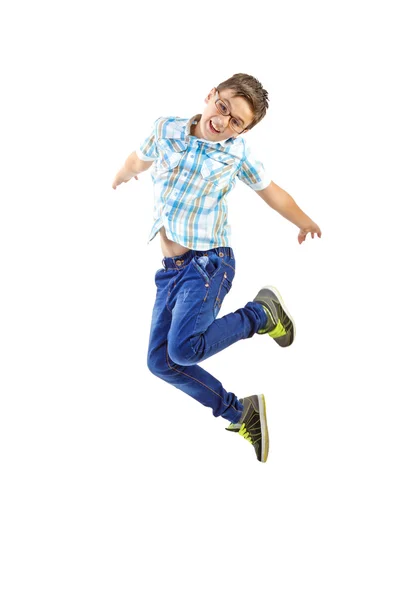 Niño saltando sobre fondo blanco — Foto de Stock