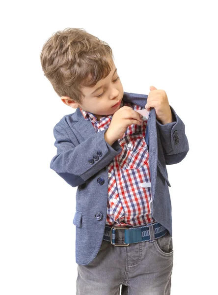 Kleine jongen zet geld in zijn zak — Stockfoto