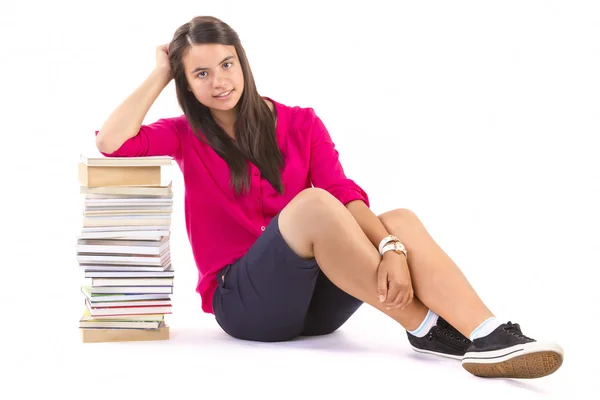 Young student girl with stack of books on white — Stock Photo, Image