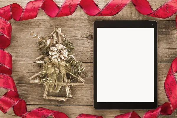 Tablet pc with christmas decorations — Stock Photo, Image