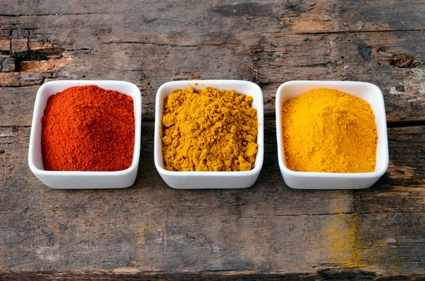 Hot red chili powder, curry and turmeric powder — Stock Photo, Image