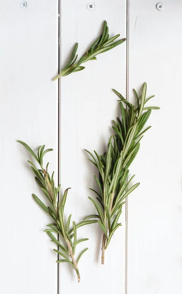 Rosemary on wooden background — Stock Photo, Image