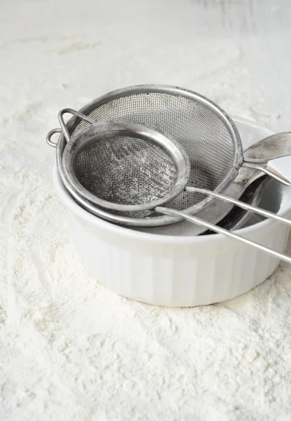 Kitchen utensils and wheat flour — Stock Photo, Image