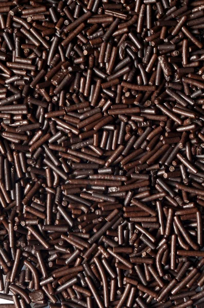 Chocolate sprinkles background — Stock Photo, Image