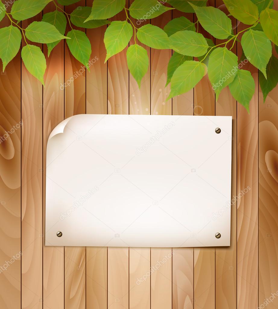 Natural wooden background with leaves and a blank piece of paper ...