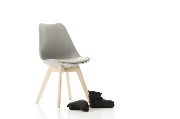 Office Chair and Pair of Back Shoes on White — Stock Photo, Image