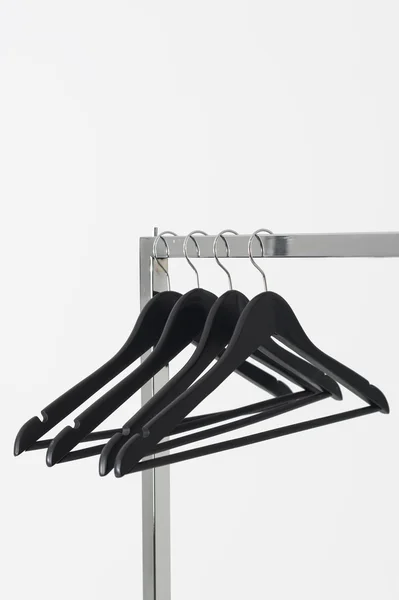 Coat hangers on a clothing rail — Stock Photo, Image