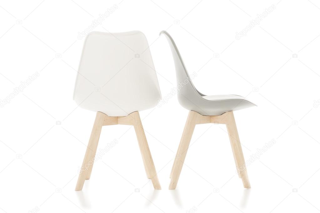 Empty Wooden Leg Chairs Isolated on White