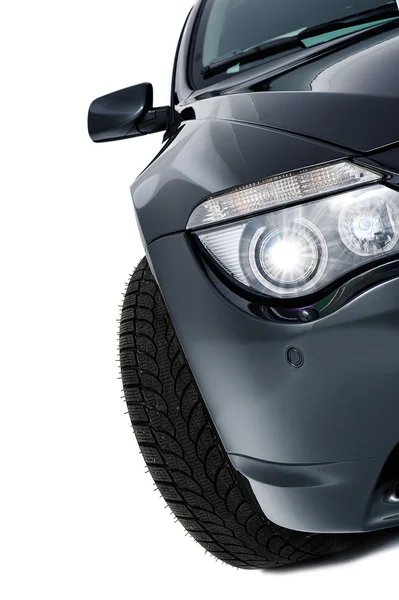 Shining headlight of a modern black car — Stock Photo, Image