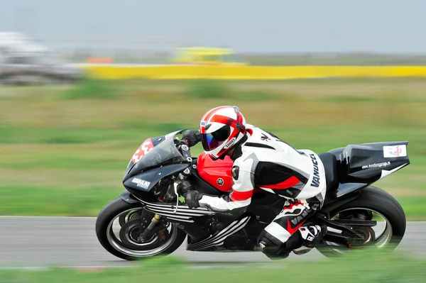 An unidentified rider on track — Stock Photo, Image