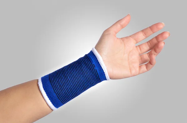 Hand with a orthopedic wrist brace — Stock Photo, Image