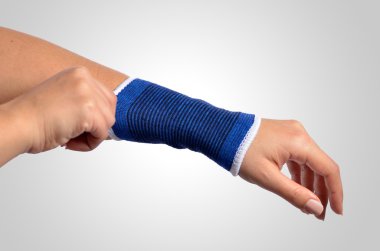 hand with a orthopedic wrist brace clipart