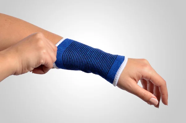 Hand with a orthopedic wrist brace — Stock Photo, Image