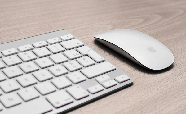 Keyboard and mouse on a wooden background — Stock Photo, Image