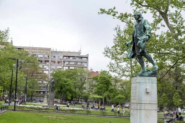 View from The Studentski Park (Academic Park) on Trg Studentski (Students Square, Avenue) with statues of important Serbian figures — Stock Photo, Image