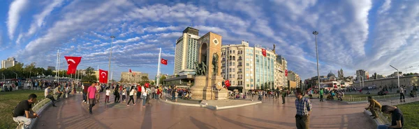 Turkish people gathering and waving flags at Taksim Square. The meetings were called Duty for Democracy after the failed July-15 coup attempt of Gulenist militants.