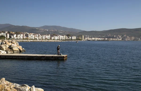 Unidentified man fishing by the coast of Marmara Sea, Gemlik, Bursa, southwest of Turkey — Stock Photo, Image