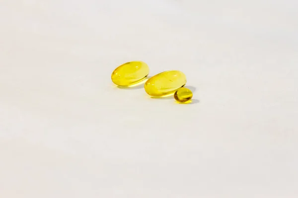 Capsule of vitamin D aka fish oil isolated on the white background