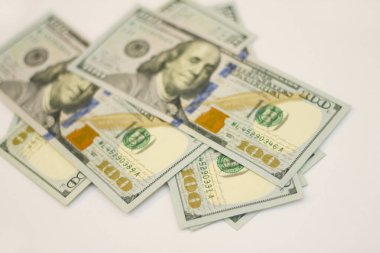 Some of new paper 100 dollars USA isolated on the white background