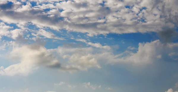 Blue sky and white clouds and the sun