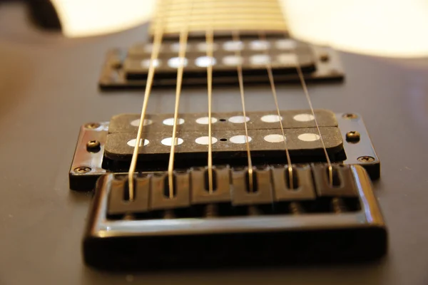 Black electric guitar isolated on the white backgriund — Stock Photo, Image