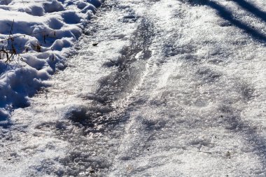 frozen country road close up in winter clipart