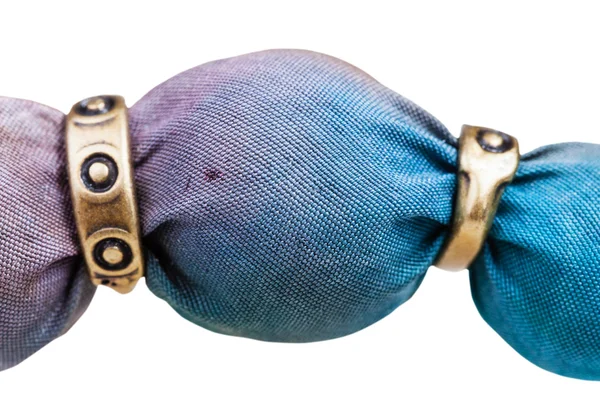 Blue painted silk batik bead and metal rings — Stock Photo, Image