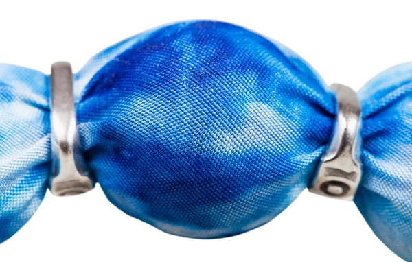 Blue painted silk batik bead and silver rings — Stock Photo, Image