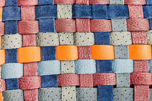 Hintergrund aus flachen geflochtenen Lederbändern — Stockfoto