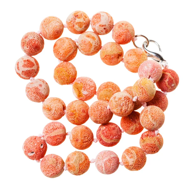 Tangled necklace from orange coral beads isolated — Stock Photo, Image