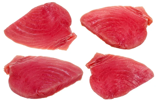 Four slices of raw tuna fish meat isolated — Stock Photo, Image