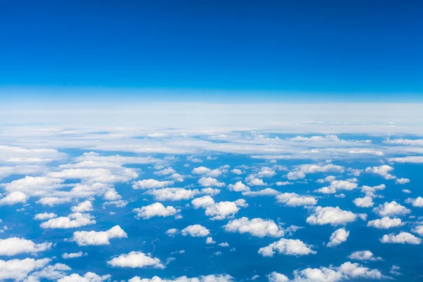 Above view many little clouds in sky from airplane — Stock Photo, Image