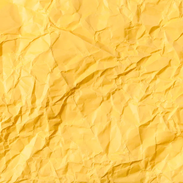 黄色の紙を丸めてから正方形の背景 — ストック写真