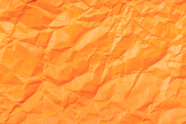 background from orange crumpled paper