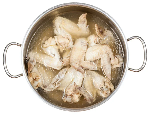 Stewpan with boiled chicken wings isolated — Stock Photo, Image