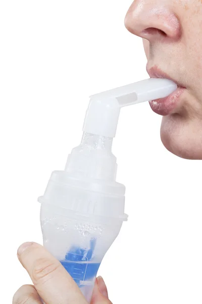 Mouthpiece of jet nebuliser in lips of woman — Stock Photo, Image