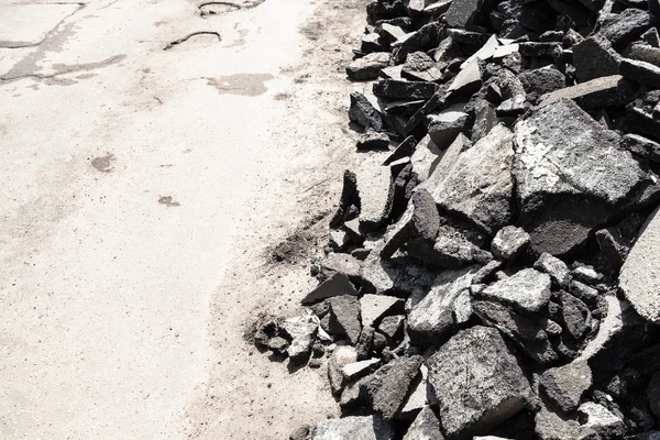 Heap of old asphalt pieces on roadside — Stock Photo, Image