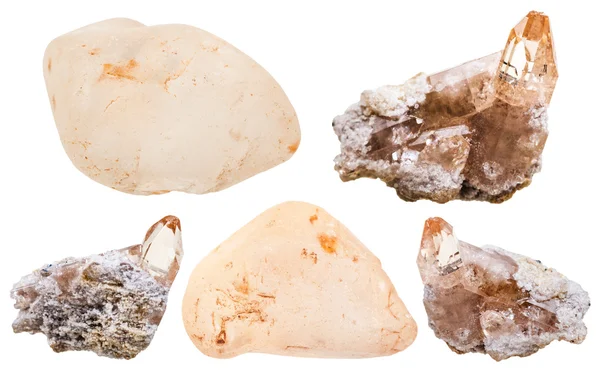 Topaz crystals on rock and polished gem stones — Stock Photo, Image
