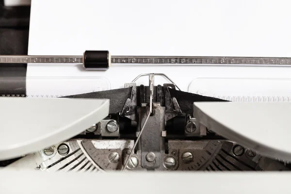 Typebar hits ink ribbon in mechanical typewriter — Stock Photo, Image
