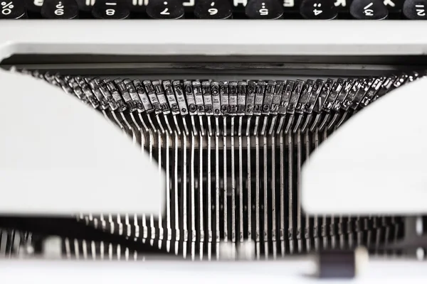 Typebars with letter characters in old typewriter — Stock Photo, Image