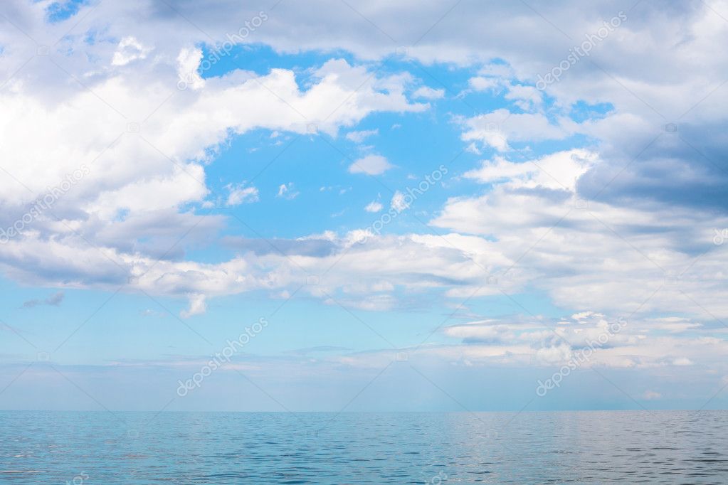 scenery of blue sky with white clouds over calm sea