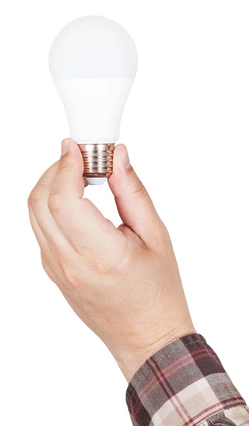 Hand holds compact LED lamp isolated — Stock Photo, Image