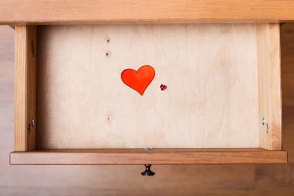 Little and big red hearts in open drawer — Stock Photo, Image