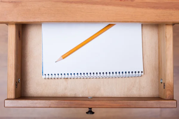 Pencil on artistic album in open drawer — Stock Photo, Image