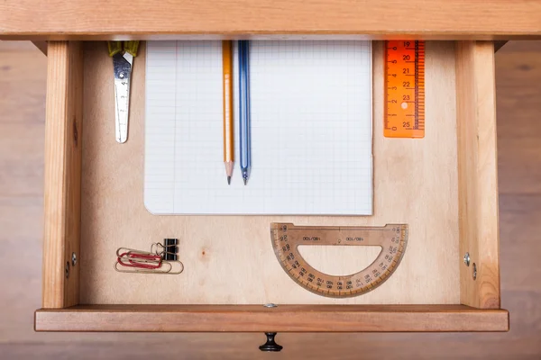 School set in open drawer — Stock Photo, Image