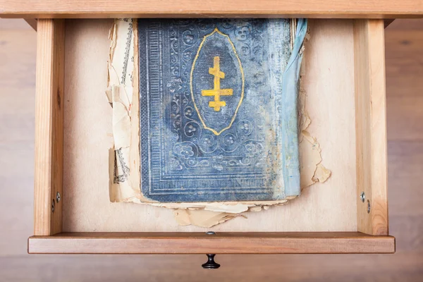 Ancient ritual book in open drawer — Stock Photo, Image