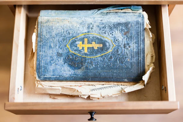 Old ritual book in open drawer — Stock Photo, Image