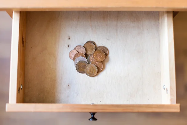 Pile of british coins in open drawer — Stock Photo, Image