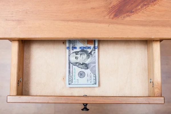 Hundred-dollar banknotes pack in open drawer — Stock Photo, Image