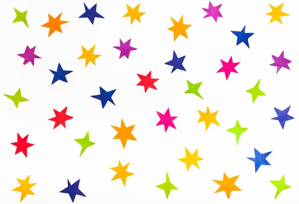 Vista dall'alto di varie stelle ritagliate fuori da carta a colori — Foto Stock